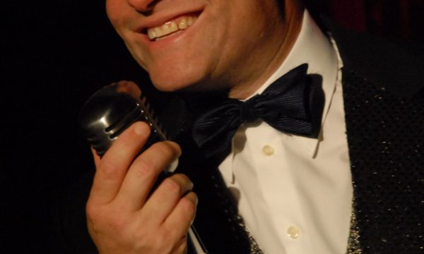 Publicity shot of Russell Moss performing at Boggs Town Cabaret.