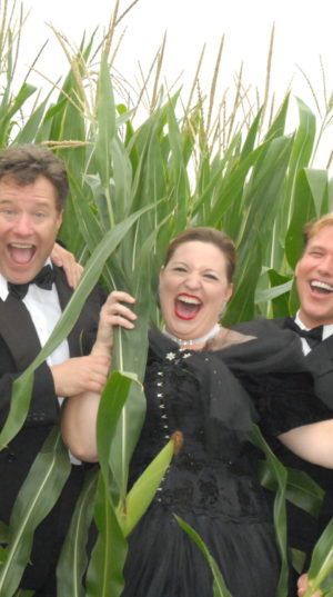 Russell Moss and Brad Zumwalt along with cast member from Boggstown Cabaret in one of the surrounding corn fields.